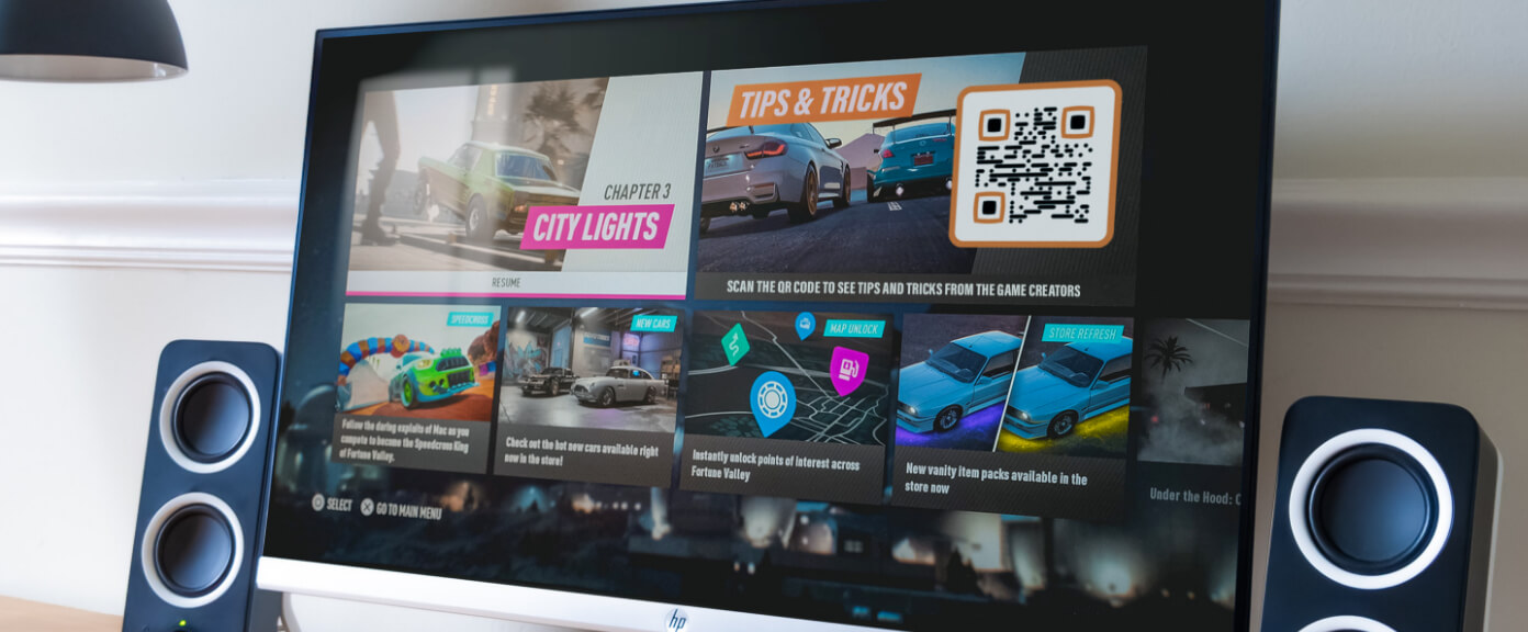 PC game main menu displaying a QR Code to access more in-game tips and tricks.